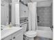Bathroom featuring a vanity, toilet with storage cabinet, and shower with tiled surround at 1100 Possum Trot Rd. # D-205, North Myrtle Beach, SC 29582