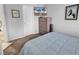 Bedroom with a TV, chest of drawers, and comfortable blue bedding at 1100 Possum Trot Rd. # D-205, North Myrtle Beach, SC 29582