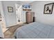 Bedroom featuring blue bedding, a TV, and a view of the bathroom at 1100 Possum Trot Rd. # D-205, North Myrtle Beach, SC 29582