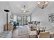 Well-decorated living room with hardwood floors, a glass table, and access to an outdoor balcony at 1100 Possum Trot Rd. # D-205, North Myrtle Beach, SC 29582