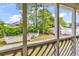 View of screened in porch with yard and fence at 1100 Possum Trot Rd. # D-205, North Myrtle Beach, SC 29582
