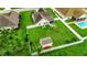 Aerial shot of the fenced backyard, showing a shed, patio, and lush green lawn at 113 Camrose Way, Myrtle Beach, SC 29588