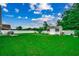 Spacious backyard with a shed, white fence, and lush green grass at 113 Camrose Way, Myrtle Beach, SC 29588