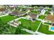Aerial view of backyard featuring a white picket fence, green lawn, and a storage shed at 113 Camrose Way, Myrtle Beach, SC 29588