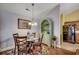 Cozy dining area featuring hardwood floors, a glass table, and stylish decor at 113 Camrose Way, Myrtle Beach, SC 29588
