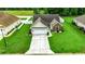 Charming home with manicured lawn, a concrete driveway, and an attached garage at 113 Camrose Way, Myrtle Beach, SC 29588