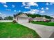 Charming single-story home with attached two-car garage and well-kept lawn at 113 Camrose Way, Myrtle Beach, SC 29588