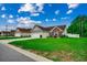 Well-maintained one-story home with vinyl siding, brick accents, and a two-car garage at 113 Camrose Way, Myrtle Beach, SC 29588