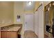 Hallway with coat closet, storage, and granite countertop desk space at 113 Camrose Way, Myrtle Beach, SC 29588