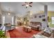 Spacious open-concept living room with a view of the dining area, and hardwood floors at 113 Camrose Way, Myrtle Beach, SC 29588