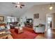 Bright living room featuring neutral walls, hardwood floors, ceiling fan, and comfortable seating at 113 Camrose Way, Myrtle Beach, SC 29588