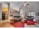 Spacious living room with vaulted ceilings, ceiling fan, hardwood flooring, and abundant natural light at 113 Camrose Way, Myrtle Beach, SC 29588