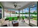 Comfortable screened-in porch with outdoor seating and a view of the backyard at 113 Camrose Way, Myrtle Beach, SC 29588