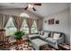 Sun-filled room with vaulted ceilings, large windows, and a comfortable lounge area at 113 Camrose Way, Myrtle Beach, SC 29588