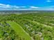 Aerial view of a residential area featuring lush green spaces and scattered homes at 1206 Spinnaker Dr., North Myrtle Beach, SC 29582