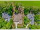 Aerial shot of a home with manicured lawns and mature trees at 1206 Spinnaker Dr., North Myrtle Beach, SC 29582
