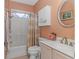 Cozy bathroom showcases an updated vanity, large mirror, and a shower-tub combo at 1206 Spinnaker Dr., North Myrtle Beach, SC 29582