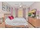 Cozy bedroom with large windows, soft natural light, and stylish furnishings and decor at 1206 Spinnaker Dr., North Myrtle Beach, SC 29582