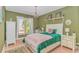 Bright bedroom with hardwood floors and a large window for natural light at 1206 Spinnaker Dr., North Myrtle Beach, SC 29582