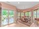 Bright breakfast nook with large windows, backyard views, and a chandelier above the table at 1206 Spinnaker Dr., North Myrtle Beach, SC 29582