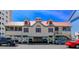 Beach house on stilts featuring a red roof, parking space underneath, and stairs to enter at 1206 Spinnaker Dr., North Myrtle Beach, SC 29582