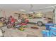 Spacious garage featuring a car, motorcycles, storage shelves, and tools at 1206 Spinnaker Dr., North Myrtle Beach, SC 29582