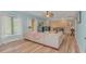 Spacious living room with hardwood floors and natural light, showcasing a cozy sectional at 1206 Spinnaker Dr., North Myrtle Beach, SC 29582