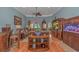 Cozy living room features hardwood floors, tray ceilings, and a decorative ceiling fan at 1206 Spinnaker Dr., North Myrtle Beach, SC 29582