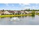 Water view property with a fountain and well manicured landscaping. Houses have screened in back porches at 122 Parmelee Dr. # A, Murrells Inlet, SC 29576