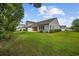 A view of the backyard and back of the home from the side at 122 Parmelee Dr. # A, Murrells Inlet, SC 29576