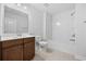 Bright bathroom with vanity, mirror, toilet, and shower/tub combo with white walls at 122 Parmelee Dr. # A, Murrells Inlet, SC 29576