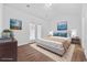 Bedroom featuring a bed, ocean artwork, a ceiling fan, and outdoor access to the backyard at 122 Parmelee Dr. # A, Murrells Inlet, SC 29576