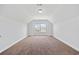 Spacious bonus room with window, neutral carpet, and light color walls at 122 Parmelee Dr. # A, Murrells Inlet, SC 29576