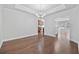 Dining room with dark wood floors, crown molding, and view of the kitchen at 122 Parmelee Dr. # A, Murrells Inlet, SC 29576
