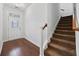 Warm entryway featuring hardwood floors, a staircase, and a stylish front door with sidelight at 122 Parmelee Dr. # A, Murrells Inlet, SC 29576