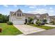 Charming townhome with a two-car garage, well-manicured lawn, and beautiful landscaping at 122 Parmelee Dr. # A, Murrells Inlet, SC 29576