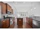 Well-equipped kitchen with stainless steel appliances, granite countertops, and hardwood floors at 122 Parmelee Dr. # A, Murrells Inlet, SC 29576