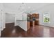 Open kitchen with granite countertops, stainless appliances, and dark wood floors at 122 Parmelee Dr. # A, Murrells Inlet, SC 29576
