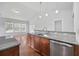 Bright and airy kitchen with a breakfast bar, granite countertops, and stainless steel dishwasher at 122 Parmelee Dr. # A, Murrells Inlet, SC 29576