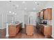 Spacious kitchen with stainless steel appliances, granite countertops, and ample cabinet space at 122 Parmelee Dr. # A, Murrells Inlet, SC 29576