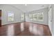 Bright living room with multiple windows offering ample natural light at 122 Parmelee Dr. # A, Murrells Inlet, SC 29576