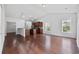 Inviting living room with hardwood floors and open views of the updated kitchen at 122 Parmelee Dr. # A, Murrells Inlet, SC 29576