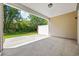 Covered patio with concrete flooring overlooking the green backyard and trees at 122 Parmelee Dr. # A, Murrells Inlet, SC 29576
