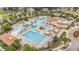 Aerial view of a community pool complex with multiple pools, seating areas, and landscaped surroundings at 1279 Fiddlehead Way, Myrtle Beach, SC 29579