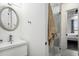 Bright bathroom featuring a stylish vanity, modern sink, and glass-enclosed shower at 1279 Fiddlehead Way, Myrtle Beach, SC 29579