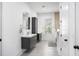 Modern bathroom featuring double vanity sinks, tile floors, and a sleek design at 1279 Fiddlehead Way, Myrtle Beach, SC 29579