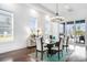Elegant dining room featuring natural light, chandelier, and convenient access to the outdoors at 1279 Fiddlehead Way, Myrtle Beach, SC 29579