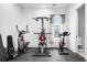 Well-equipped gym with exercise machines, window for natural light, and rubber flooring at 1279 Fiddlehead Way, Myrtle Beach, SC 29579