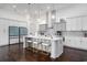Modern kitchen with stainless steel appliances, a large island, and stylish pendant lighting at 1279 Fiddlehead Way, Myrtle Beach, SC 29579