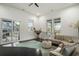 Inviting living area with sliding glass doors, comfortable seating, and bright lighting at 1279 Fiddlehead Way, Myrtle Beach, SC 29579